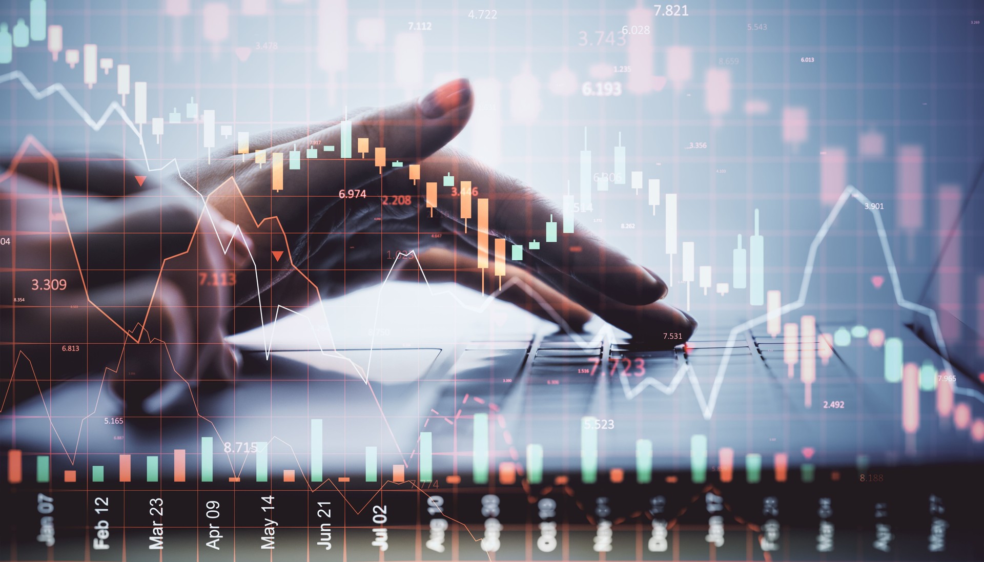 Person typing on laptop with financial stock market crash charts overlayed in red tones, symbolizing global economic crisis and investment loss.